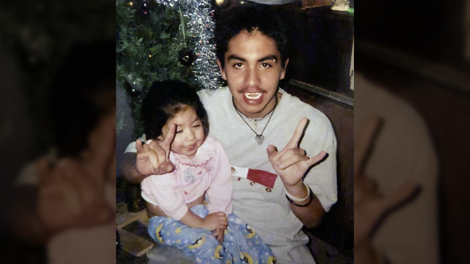 Escalera, shown here with his young sister in 1998, dreams of one day obtaining his U.S. citizenship. 