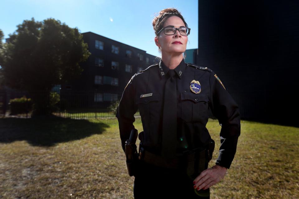 Jacksonville Sheriff's Office Lt. Jamie Eason stands outside the Downtown East Apartments (formerly Franklin Arms) where she worked for years.