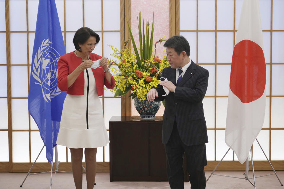 United Nations Secretary General's Special Envoy to Myanmar Christine Schraner Burgener, left, and Japan's Foreign Minister Toshimitsu Motegi pose for media during a courtesy call at the Ministry of Foreign Affairs Friday, May 28, 2021, in Tokyo. (AP Photo/Eugene Hoshiko, POOL)