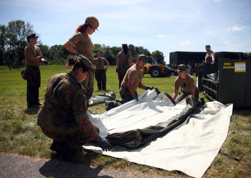 Soldiers of the German armed forces Bundeswehr build tents to be used as a testing site for the coronavirus disease (COVID-19) in Landau an der Isar