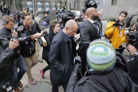 Stormy Daniels' attorney Michael Avenatti leaves federal court surrounded by news media in the Manhattan borough of New York City, New York, U.S., April 16, 2018. REUTERS/Lucas Jackson