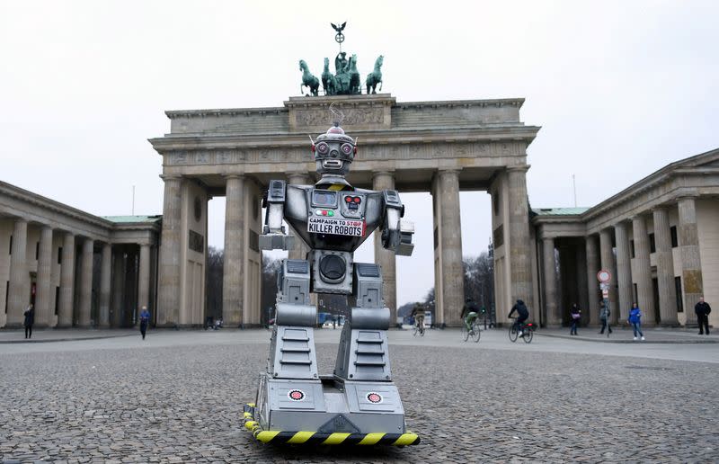 FILE PHOTO: A robot is pictured as activists from the Campaign to Stop Killer Robots, a coalition of non-governmental organisations opposing lethal autonomous weapons or so-called 'killer robots', stage a protest at Brandenburg Gate in Berlin