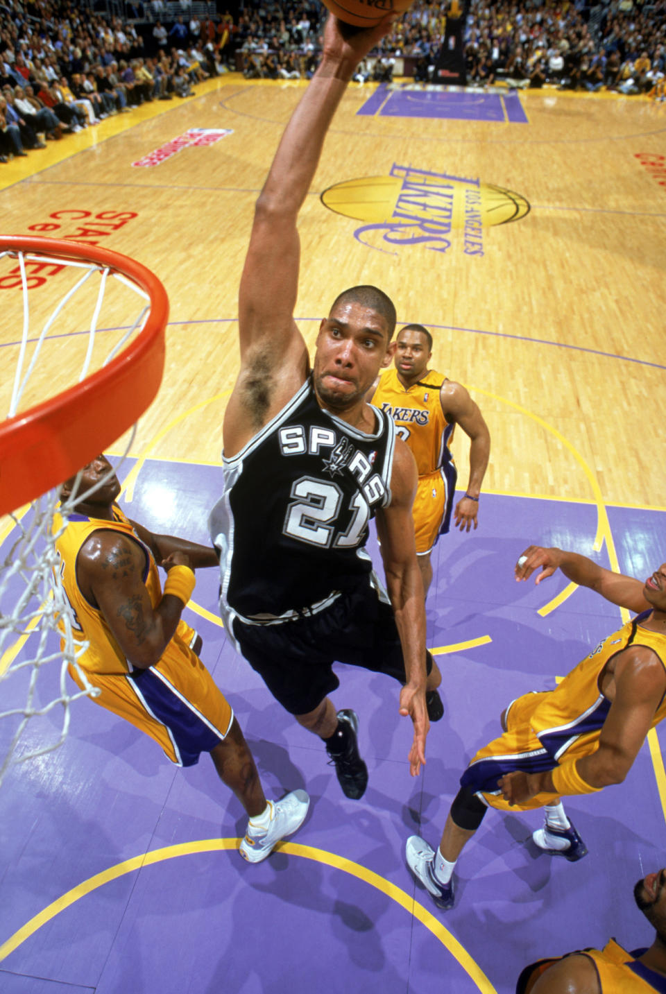 <p>2003: Tim Duncan #21 of the San Antonio Spurs goes up to dunk against the Los Angeles Lakers in Game Three of the Western Conference Semifinals during the 2003 NBA Playoffs at Staples Center on May 9, 2003 in Los Angeles, California. <br></p>