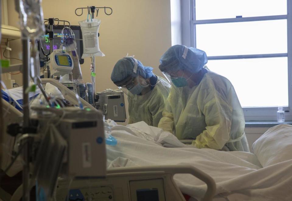 Nurses tend to a patient on a ventilator at a New York hospital