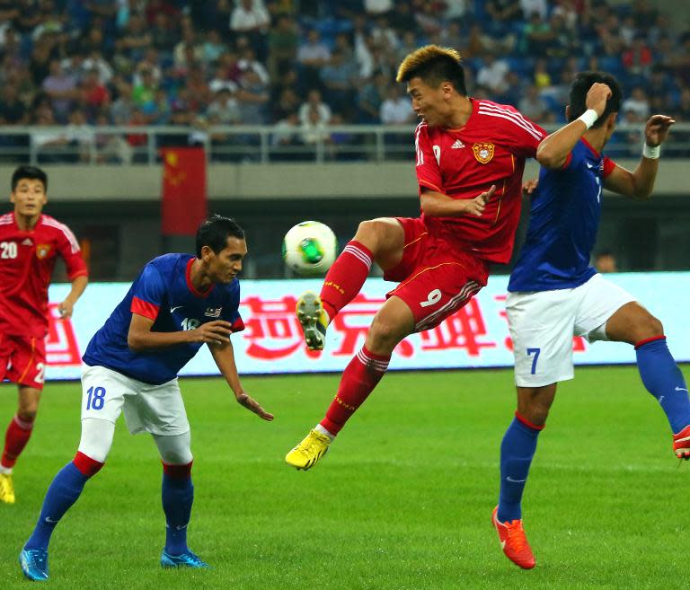 Yang Xu (centre), pictured in action for China in September 2013, was sent off as Shandong Luneng crashed 4-1 to Jeonbuk Hyundai Motors in the AFC Champions League on March 3, 2015