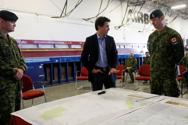 Canada’s Prime Minister Justin Trudeau speaks with Canadian Forces personnel