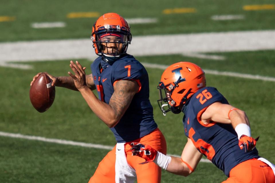 Quarterback Coran Taylor (7) passes against the Purdue Boilermakers during a 2020 game at Memorial Stadium. Taylor, a Peoria High grad, has transferred to Alabama A&M.