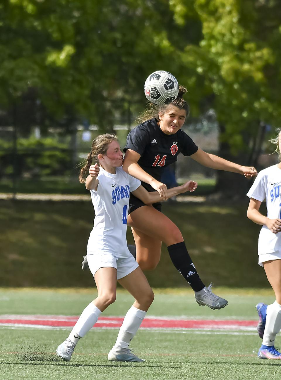 Michelle Lindberg (14) of Indian Hill and Delaney Kintner (4) of Summit Country Day battle for the ball in their match at Shawnee Field on Saturday, Oct. 1. The Silver Knights take on Monroe in a Division II regional semifinal Tuesday.