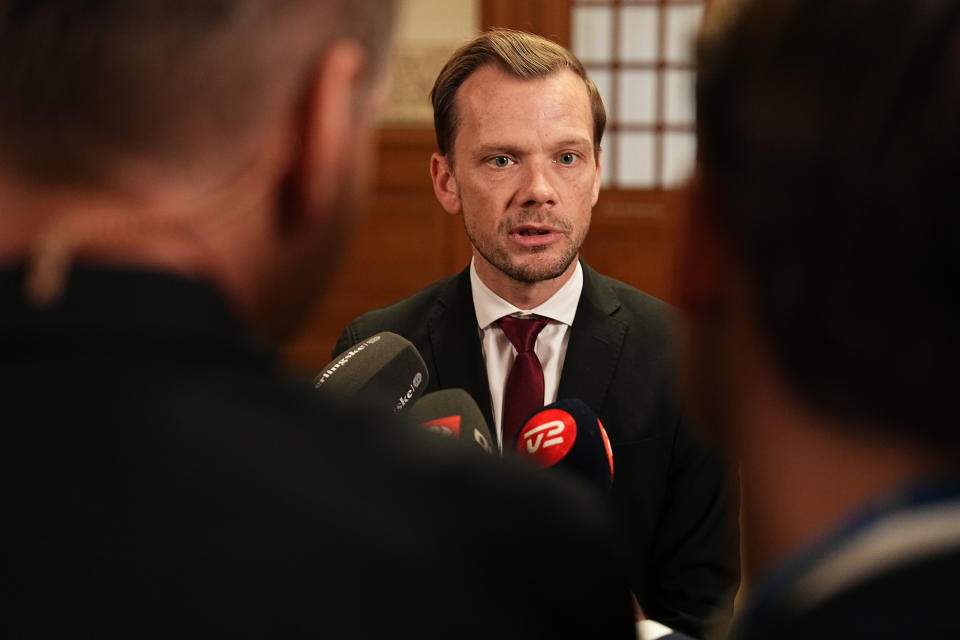 Denmark's Minister of Justice Peter Hummelgaard talks to the media after a vote for a new law against inappropriate treatment of writings of importance to religious communities, in Copenhagen, Denmark, Thursday Dec. 7, 2023. A new law was passed in Denmark's parliament on Thursday, Dec. 7, 2023, that makes it illegal to desecrate any holy text in the country, after a recent string of public desecrations of the Quran by a handful of anti-Islam activists sparked angry demonstrations in Muslim countries. (Mads Claus Rasmussen/Ritzau Scanpix via AP)