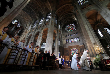 A general view during Easter Sunday Mass at Saint-Eustache, days after a massive fire devastated large parts of the structure of the gothic Notre-Dame Cathedral, in Paris, France, April 21, 2019. REUTERS/Gonzalo Fuentes
