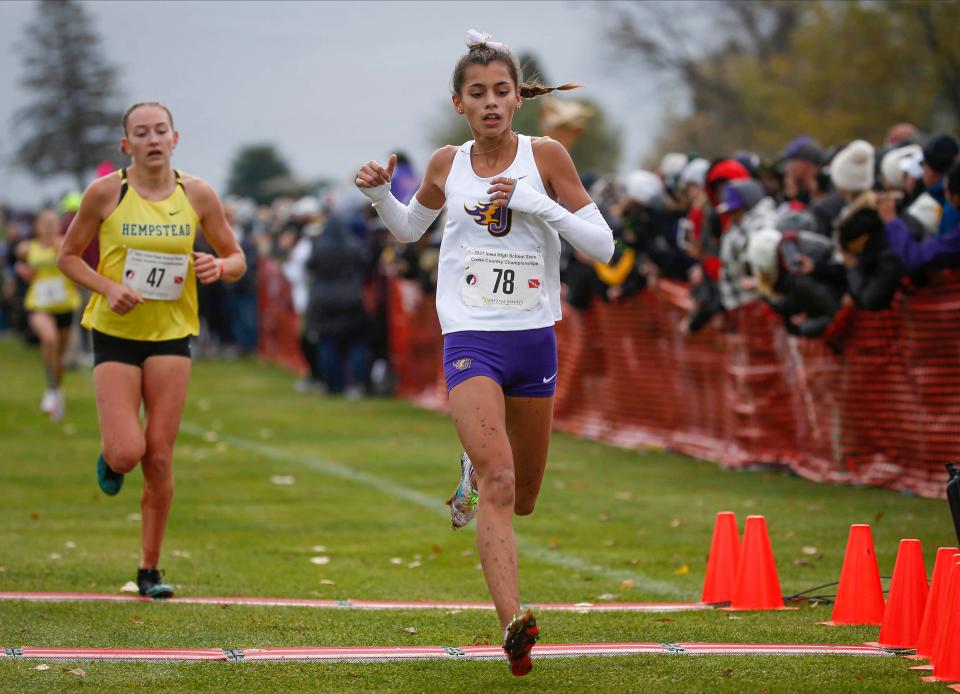 Johnston junior Olivia Verde crosses the finish line for a fourth-place finish during last year's 4A cross country finals