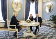 Russian President Vladimir Putin, right, speaks to French far-right presidential candidate Marine Le Pen, left, in the Kremlin in Moscow, Russia, Friday, March 24, 2017. Putin has held a surprise meeting with France’s far-right presidential candidate and dismissed suggestions that Russia aims to influence the election in her favor. (Mikhail Klimentyev, Sputnik, Kremlin Pool Photo via AP)