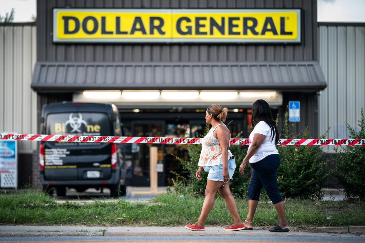 Image: People walk past the Dollar General store where three people were shot and killed the day before on Aug. 27, 2023 in Jacksonville, Fla. (Sean Rayford / Getty Images)