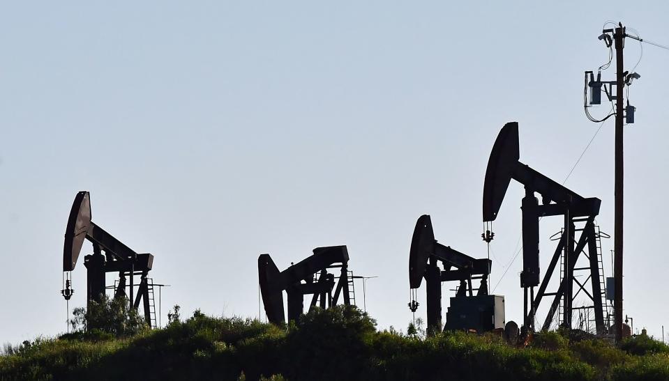 Working pumpjacks are seen in the Montebello Oil Field in Montebello, California, on February 23, 2022. - Stock markets mostly rose and oil prices held relatively steady on February 23 as economic sanctions imposed on Moscow over the Russia-Ukraine crisis were deemed less harsh than expected. Brent crude stood at $96.73 per barrel, having soared to a seven-year high of $99.50 on February 22 on fears of disruptions to key Russian oil supplies. (Photo by Frederic J. BROWN / AFP) (Photo by FREDERIC J. BROWN/AFP via Getty Images)