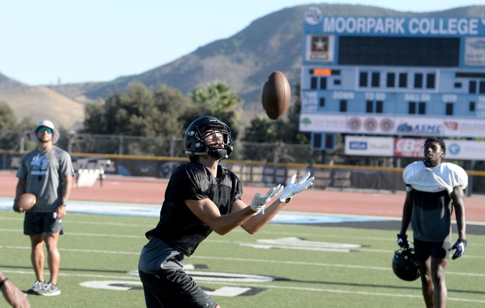 Safety Daniel Pierce makes a catch during a Moorpark College football team practice on Wednesday. The Raiders open their season at Ventura College on Saturday night.