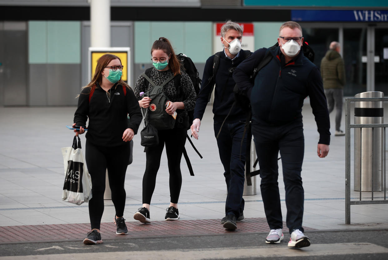 Ellie Durrant (left), Alice Nuttall, 21 (2nd left) John Nuttall, 56 (2nd right) from Nantwich leave the terminal as passengers that travelled on a repatriation flight from Peru arrive at Gatwick Airport in Sussex as the government continues to help tens of thousands of Britons that remain stranded abroad by the coronavirus pandemic. (Photo by Adam Davy/PA Images via Getty Images)