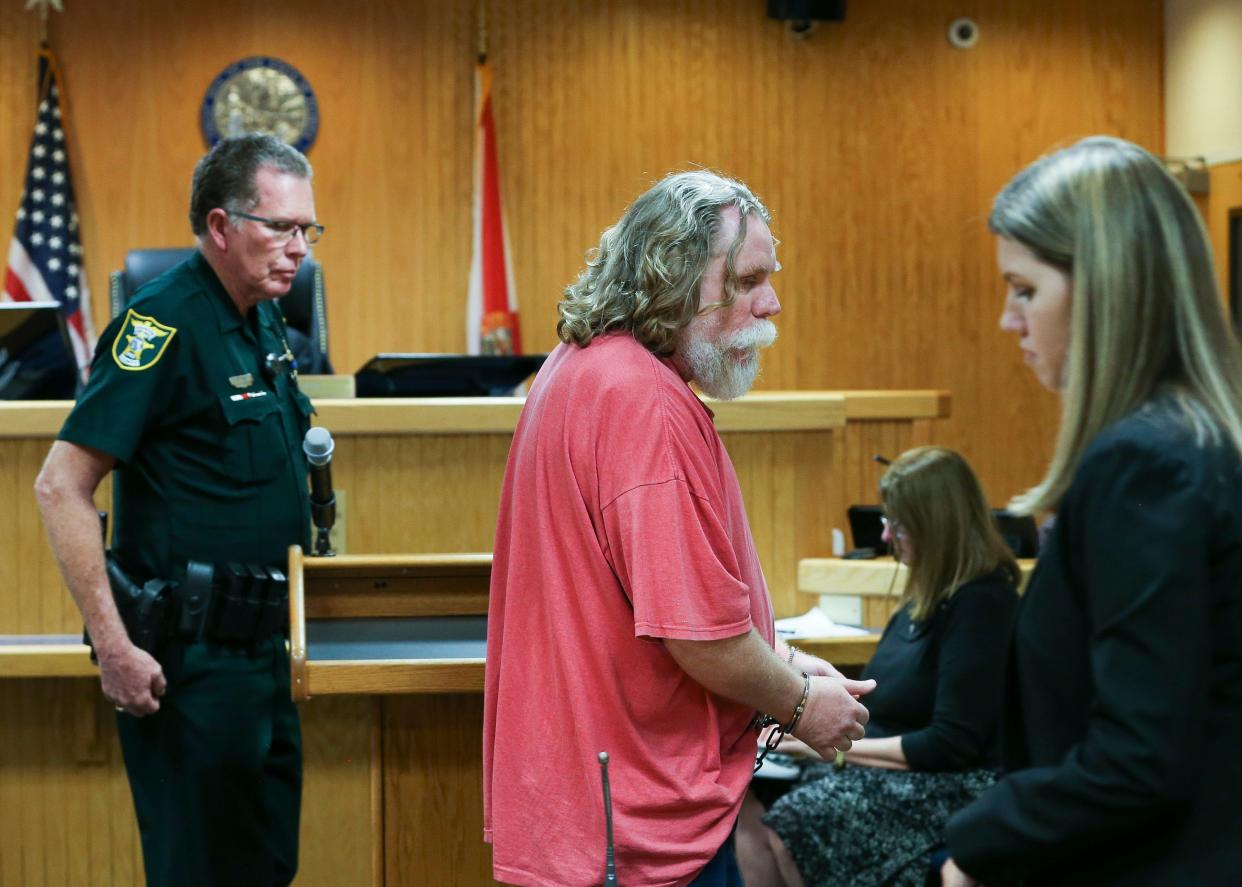 Chester Price (middle), 49, was at the Martin County Courthouse Wednesday, Feb. 12, 2020, in Stuart, to sign an agreement with the state to be voluntarily held in civil custody to receive treatment as a sexual predator under Florida's Jimmy Ryce Act. Price was convicted in 2014 for the 1993 death of Andrea Parsons, a 10-year-old Port Salerno girl.