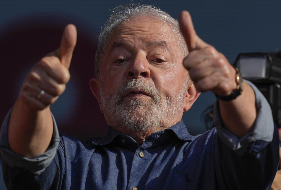 Former Brazilian President Luiz Inacio Lula da Silva, who is running for reelection with the Workers Party, gestures to supporters during a May Day rally in Sao Paulo, Brazil, Sunday, May 1, 2022. (AP Photo/Andre Penner)