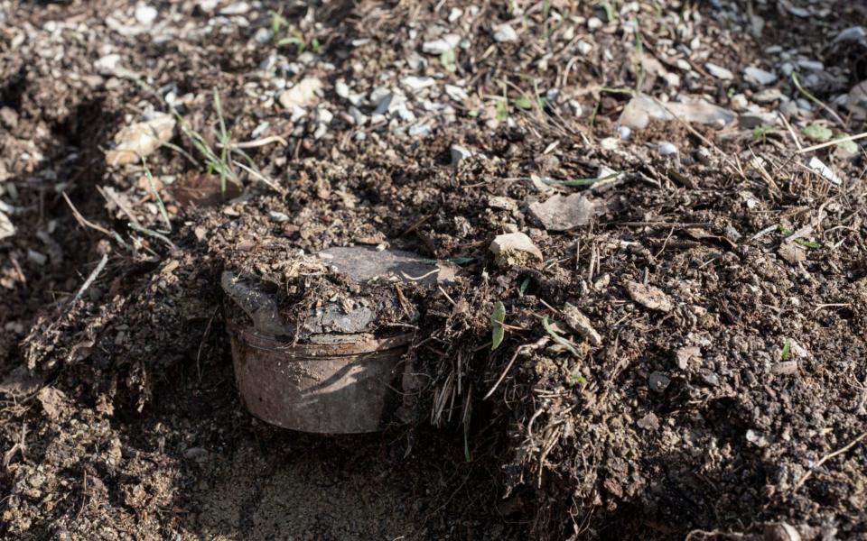 An old anti-personnel landmine awaits demolition in a minefield planted during the Iran-Iraq war, in the village of Dir - Sam Tarling /Sam Tarling 