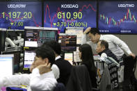 Currency traders watch monitors at the foreign exchange dealing room of the KEB Hana Bank headquarters in Seoul, South Korea, Tuesday, March 10, 2020. Shares edged slightly lower in Tokyo and Seoul after bouncing in and out of negative territory. (AP Photo/Ahn Young-joon)