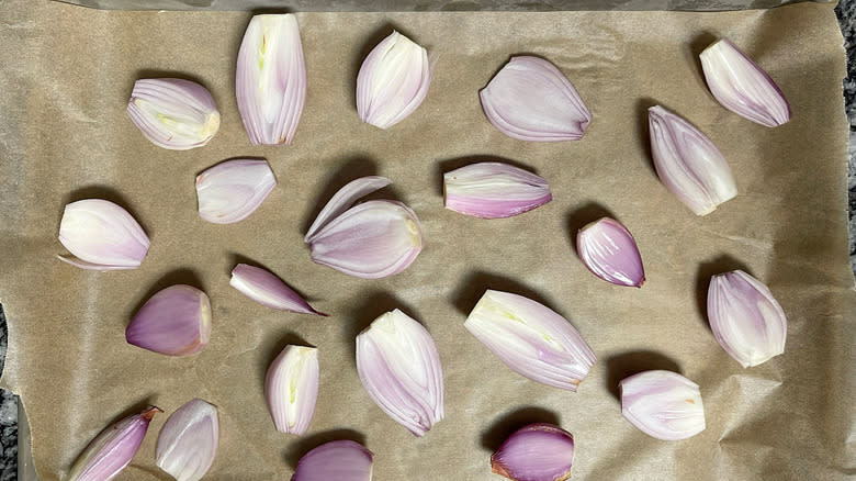 shallots on parchment lined baking sheet