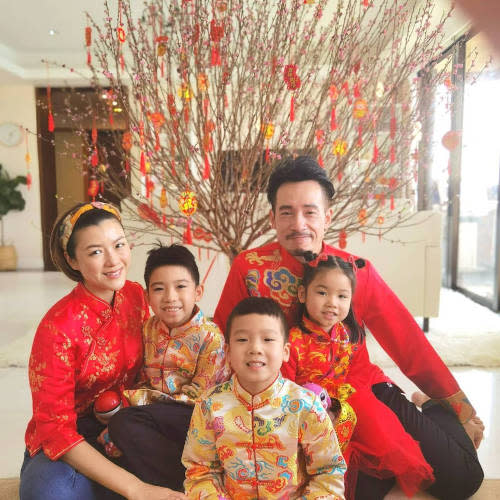 Moses with wife and kids during the Lunar New Year