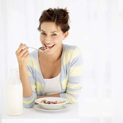 Woman eating cereal