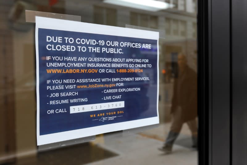 Signage is seen posted on the entrance of the New York State Department of Labor offices, who closed to the public due to the coronavirus disease (COVID-19) outbreak in the Brooklyn borough of New York City