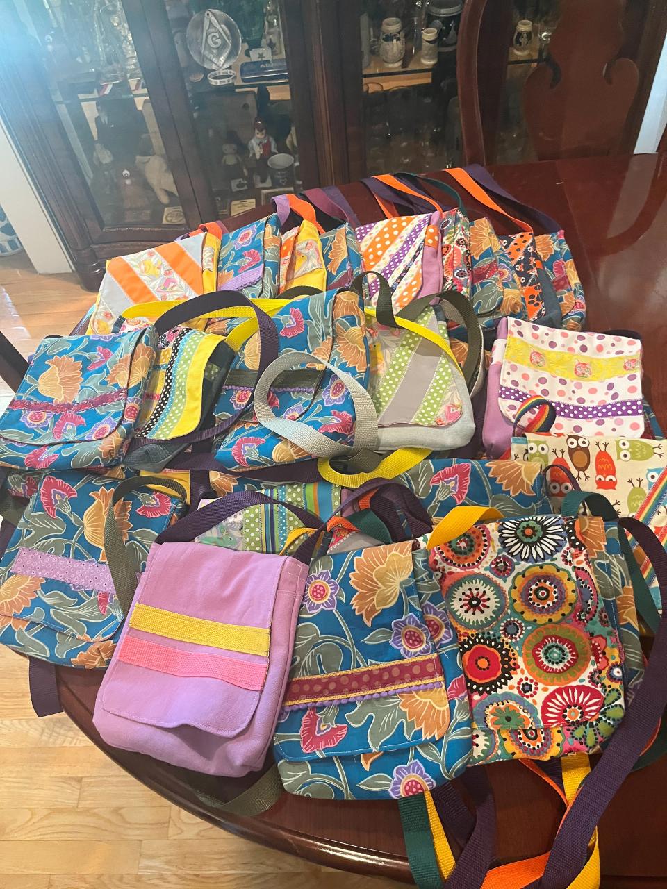 These purses were made for girls and young women in Africa by the Shelby County volunteer group purSEWverance as part of Sew Powerful's annual "Sew-a-Thon" fundraiser.
