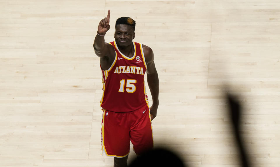 Atlanta Hawks center Clint Capela (15) reacts after a play against New York Knicks forward Julius Randle (30) during the second half in Game 3 of an NBA basketball first-round playoff series Friday, May 28, 2021, in Atlanta. (AP Photo/Brynn Anderson)