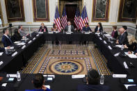 Doug Emhoff, center, the husband of Vice President Kamala Harris, speaks during a roundtable discussion with Jewish leaders about the rise in antisemitism and efforts to fight hate in the United States in the Indian Treaty Room in the Eisenhower Executive Office Building on the White House Campus in Washington, Wednesday, Dec. 7, 2022. (AP Photo/Patrick Semansky)