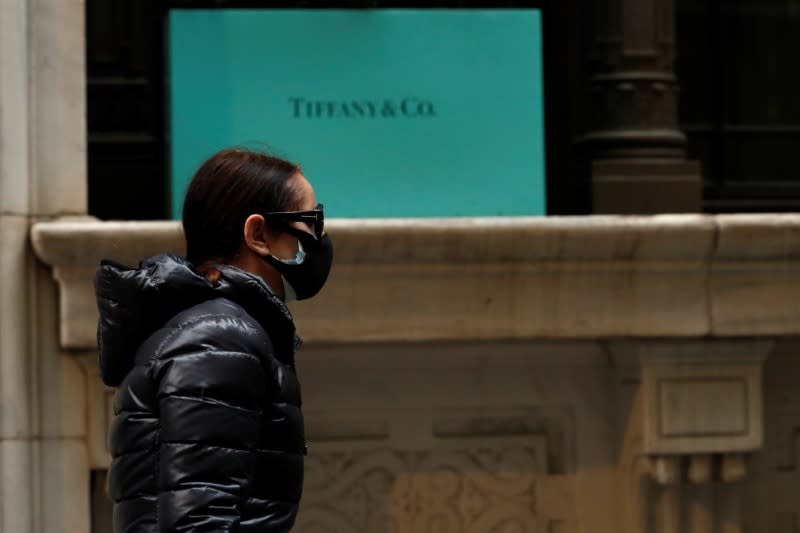 FILE PHOTO: A man passes by the closed Tiffany & Co store on Wall St. in the financial district of New York