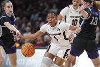 South Carolina guard Zia Cooke (1) drives between Kansas State's Serena Sundell, left, and Laura Macke (13) during the first half of an NCAA college basketball game Friday, Dec. 3, 2021, in Columbia, S.C. (AP Photo/Sean Rayford)