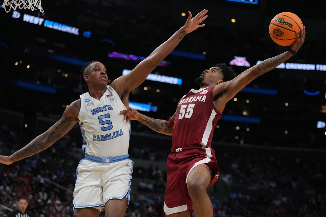 Alabama's Aaron Estrada (55) shoots against North Carolina's Armando Bacot.