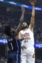 Cleveland Cavaliers center Jarrett Allen (31) shoots against Orlando Magic forward Jonathan Isaac (1) during the first half of Game 2 of an NBA basketball first-round playoff series, Monday, April 22, 2024, in Cleveland. (AP Photo/Ron Schwane)