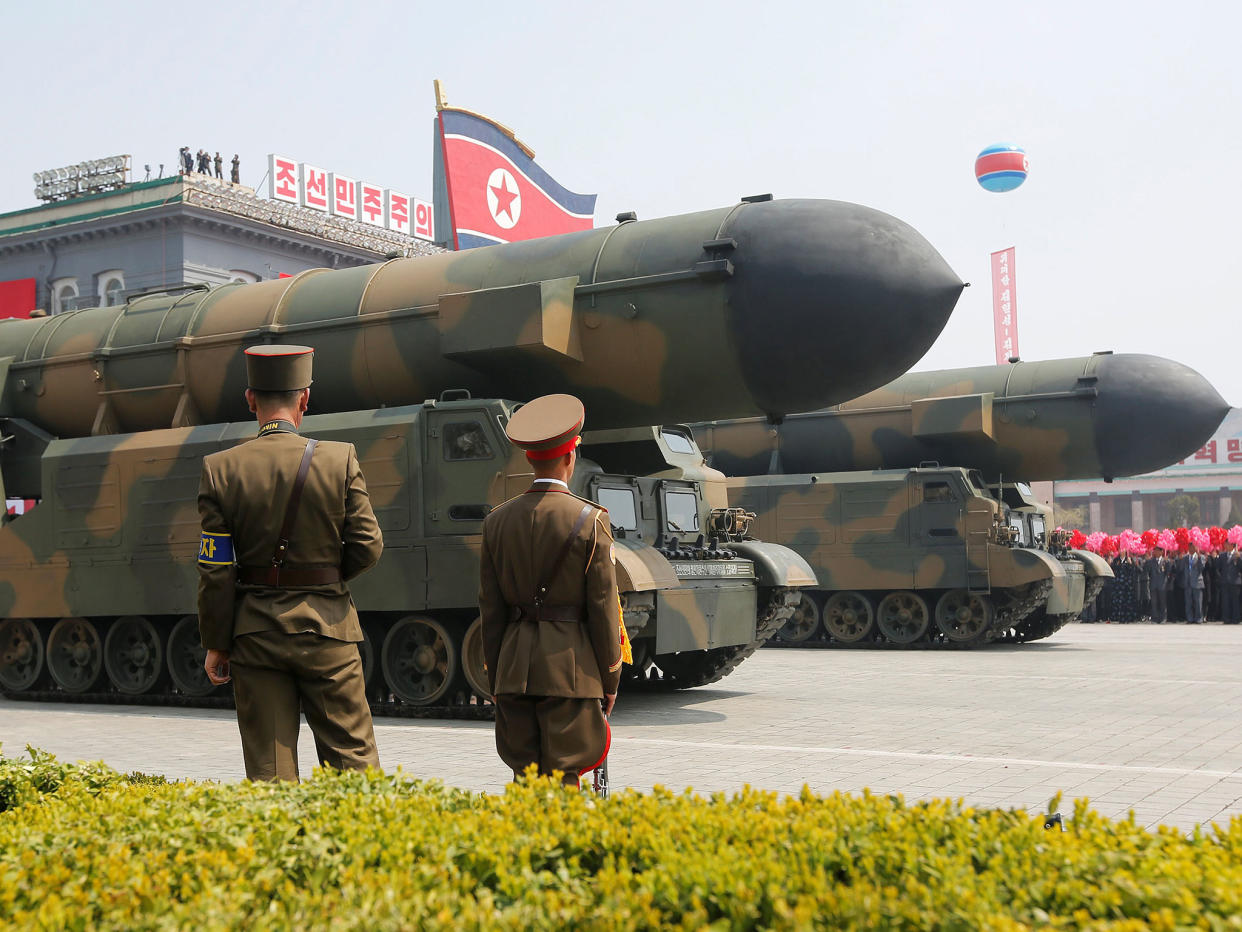 Missiles are driven past the stand with North Korean leader Kim Jong-un and other high ranking officials during a military parade in Pyongyang: Reuters