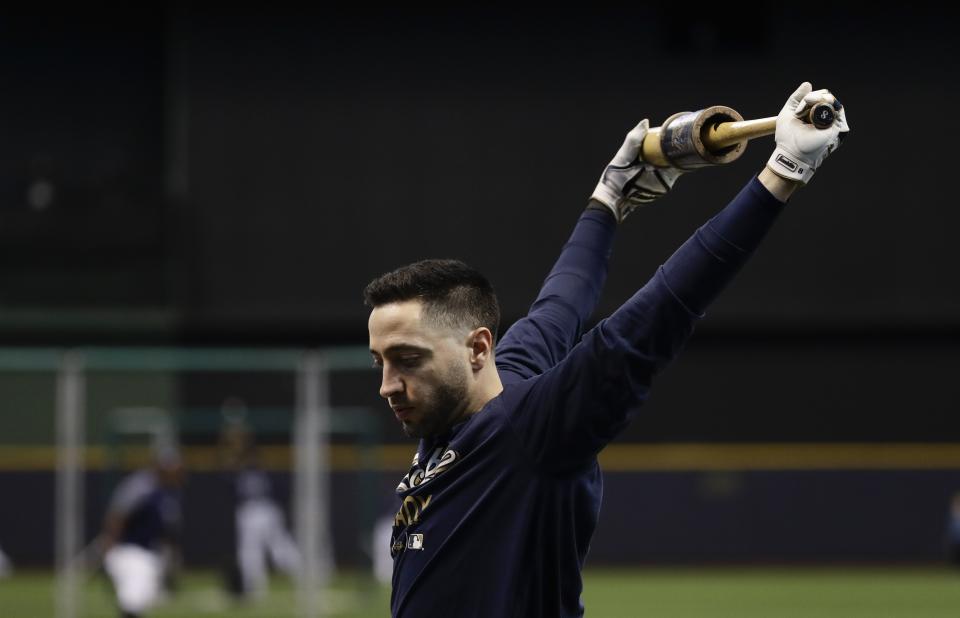 Milwaukee Brewers' Ryan Braun warms up for practice for Game 1 of the National League Championship Series baseball game Los Angeles Dodgers Thursday, Oct. 11, 2018, in Milwaukee. (AP Photo/Matt Slocum)