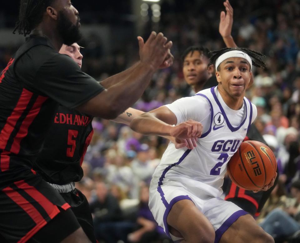 Nov 26, 2022; Phoenix, Arizona, USA; Grand Canyon Lopes guard Chance McMillian (2) drives into the lane against the Benedictine University at Mesa Redhawks at GCU Arena. Mandatory Credit: Joe Rondone-Arizona Republic