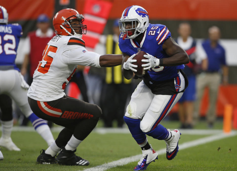 FILE - In this Aug. 17, 2018, file photo, Buffalo Bills running back LeSean McCoy (25) rushes against Cleveland Browns defensive end Myles Garrett (95) during the first half of an NFL football preseason game, in Cleveland. Whoever is under center will have LeSean McCoy in the backfield. Even at 30, he's expected to be a workhorse.(AP Photo/Ron Schwane, File)