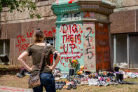 <p>Shoes were laid around the statue of Egerton Ryerson at Ryerson University as a memorial following the discovery of 215 bodies of students from residential schools in Kamloops, British Columbia. (Photo by Shawn Goldberg/SOPA Images/LightRocket via Getty Images)</p> 