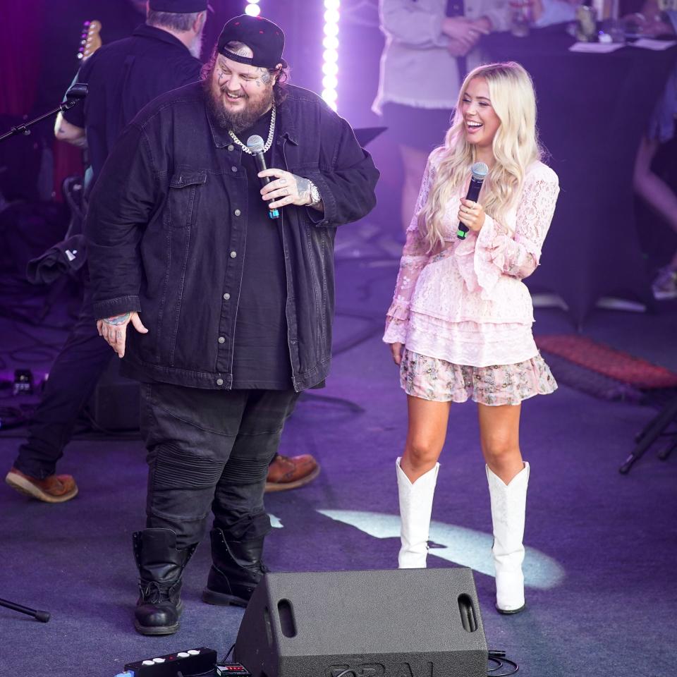 Jelly Roll speaks with Megan Moroney during an Opry NextStage Live event at Lava Cantina in The Colony, Texas, Wednesday, May 10, 2023.