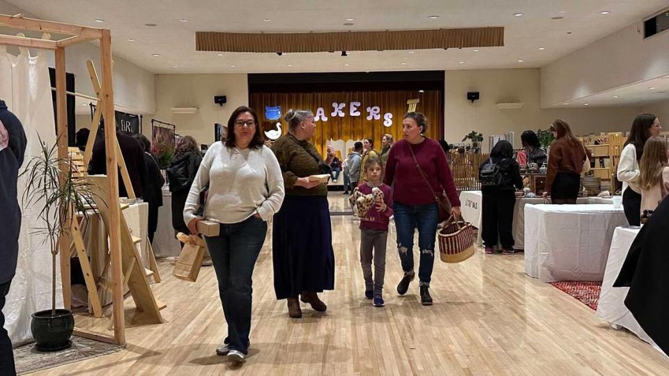 Visitors and vendors on Saturday, Dec. 9, 2023, pack the Scottish Rite Masonic Center on H Street in East Sacramento for the Makers Mart holiday craft fair