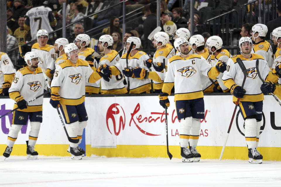 Nashville Predators center Colton Sissons, front right, celebrates at the bench after scoring during the second period of an NHL hockey game against the Vegas Golden Knights, Monday, Jan. 15, 2024, in Las Vegas. (AP Photo/Ellen Schmidt)