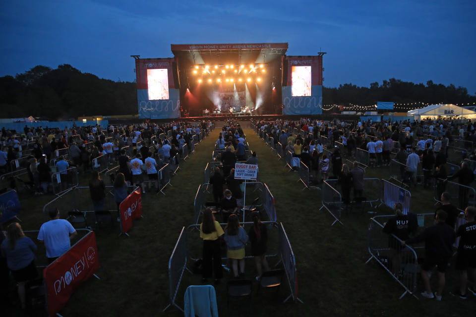 Sam Fender on stage at the Virgin Money Unity Arena, a pop-up venue in Gosforth Park, Newcastle. Fans in groups of up to five people are watching the show from 500 separate raised metal platforms at what the promoters say is the world's first socially-distanced gig.