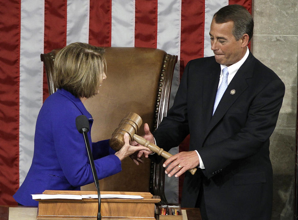 FILE - This Jan. 5, 2011 file photo shows then-outgoing House Speaker Nancy Pelosi of Calif. handing the gavel to the new House Speaker John Boehner of Ohio during the first session of the 112th Congress on Capitol Hill in Washington. Democratic candidates for the House pulled off a dubious feat in the 2012 election: Collectively, they got more votes than their Republican opponents, but they didn't win the most seats. It was only the second time since World War II that the party receiving the most votes failed to win a majority of seats in the House. The other time was 1996, and the scenario was similar (AP Photo/Charles Dharapak, File)