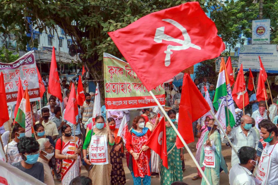 Members of various political parties block Santiniketan road during a protest against the farm bills passed in both the Houses of Parliament recently, at Bolpur in Birbhum district, Friday, Sept. 25, 2020. (PTI Photo)