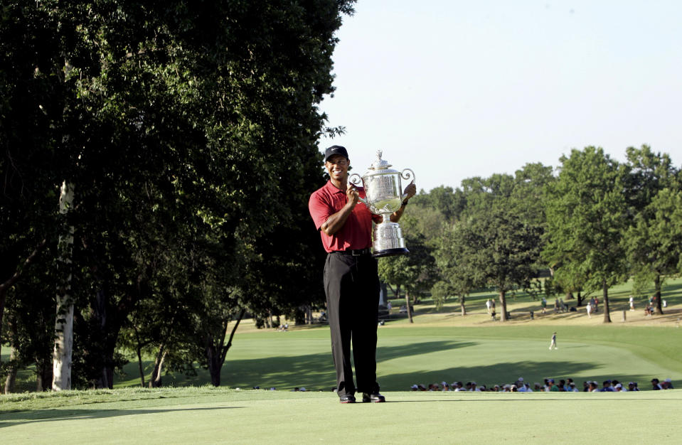 File - In this Aug. 12, 2007, file photo, Tiger Woods holds up the Wanamaker Trophy after winning the 89th PGA Golf Championship at the Southern Hills Country Club in Tulsa, Okla. The PGA Championship is returning to Southern Hills in 2022 to fill in for Trump National in New Jersey. (AP Photo/Morry Gash, File)