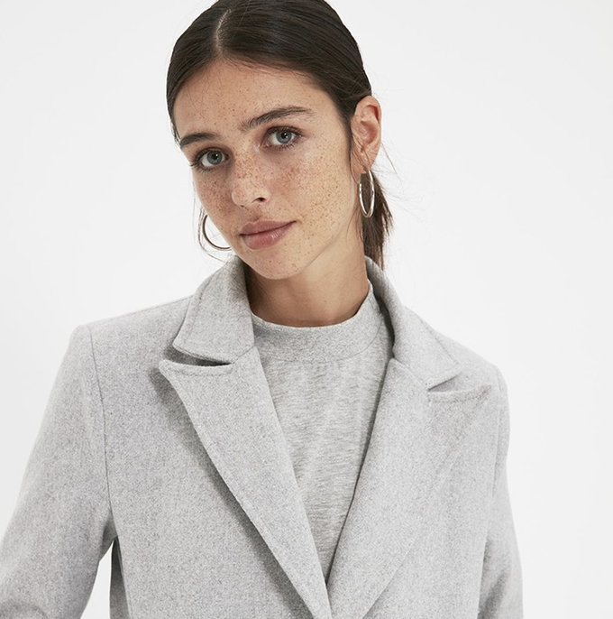 A model wears a Trendyol Gray Coat.