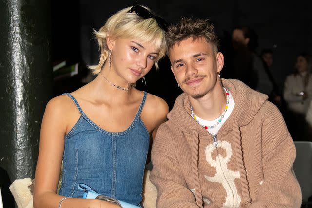 <p>Chris Ratcliffe/BFC/Getty </p> Mia Regan (left) and Romeo Beckham attend the JW Anderson show during London Fashion Week on Feb. 19, 2023 in London