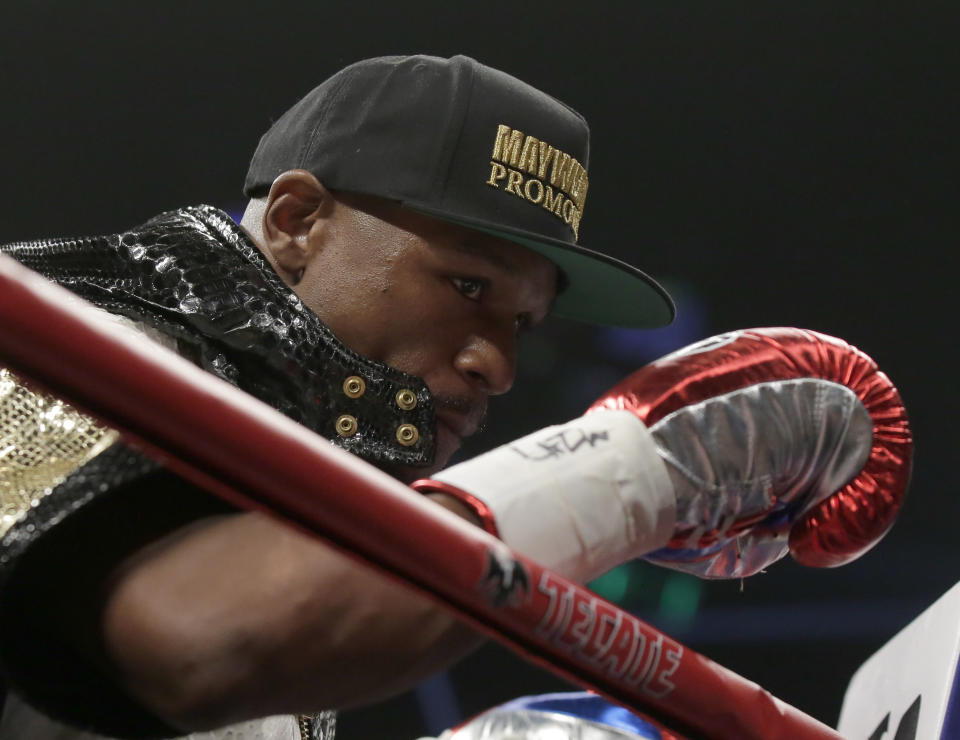 Floyd Mayweather Jr., gets ready before the welterweight title fight against Manny Pacquiao, from the Philippines, on Saturday, May 2, 2015 in Las Vegas. (AP Photo/Isaac Brekken)